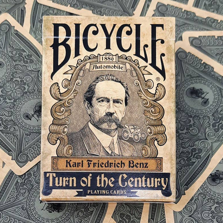Bicycle playing card box with a vintage design featuring Karl Friedrich Benz on a patterned background.