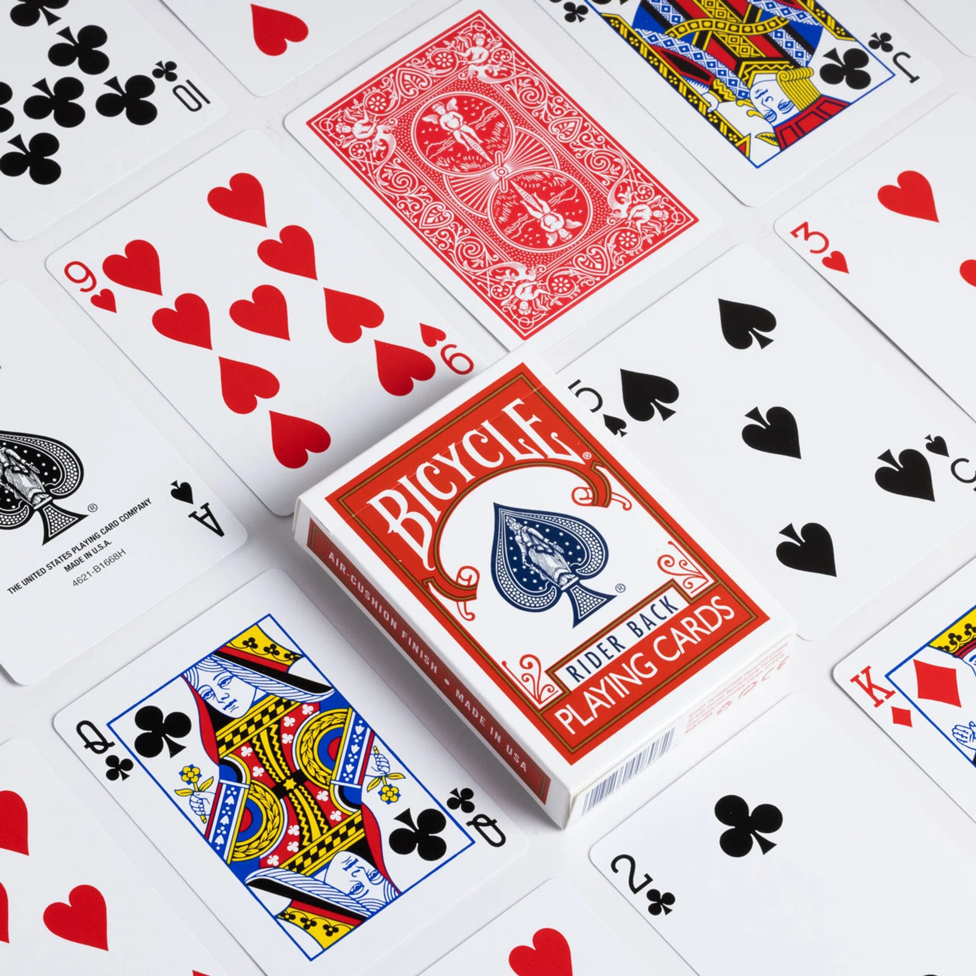 Bicycle playing cards with various card faces displayed on a white background