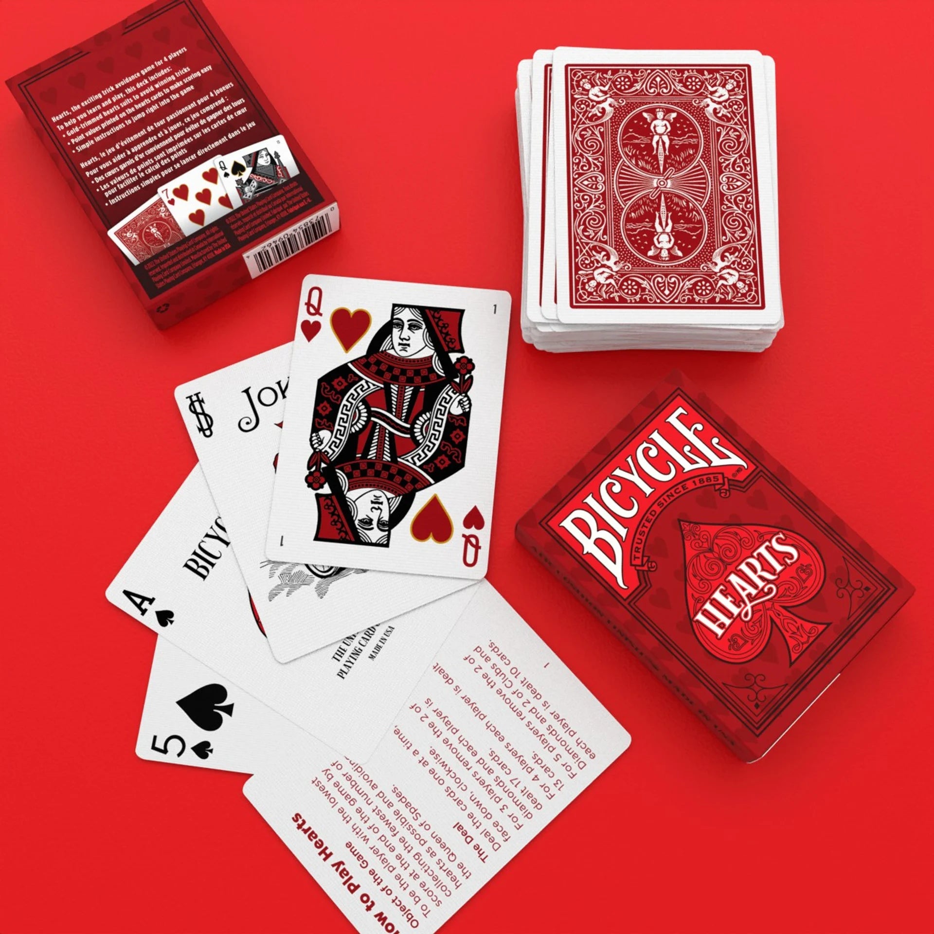 Red playing cards with 'Bicycle Hearts' branding on a red background