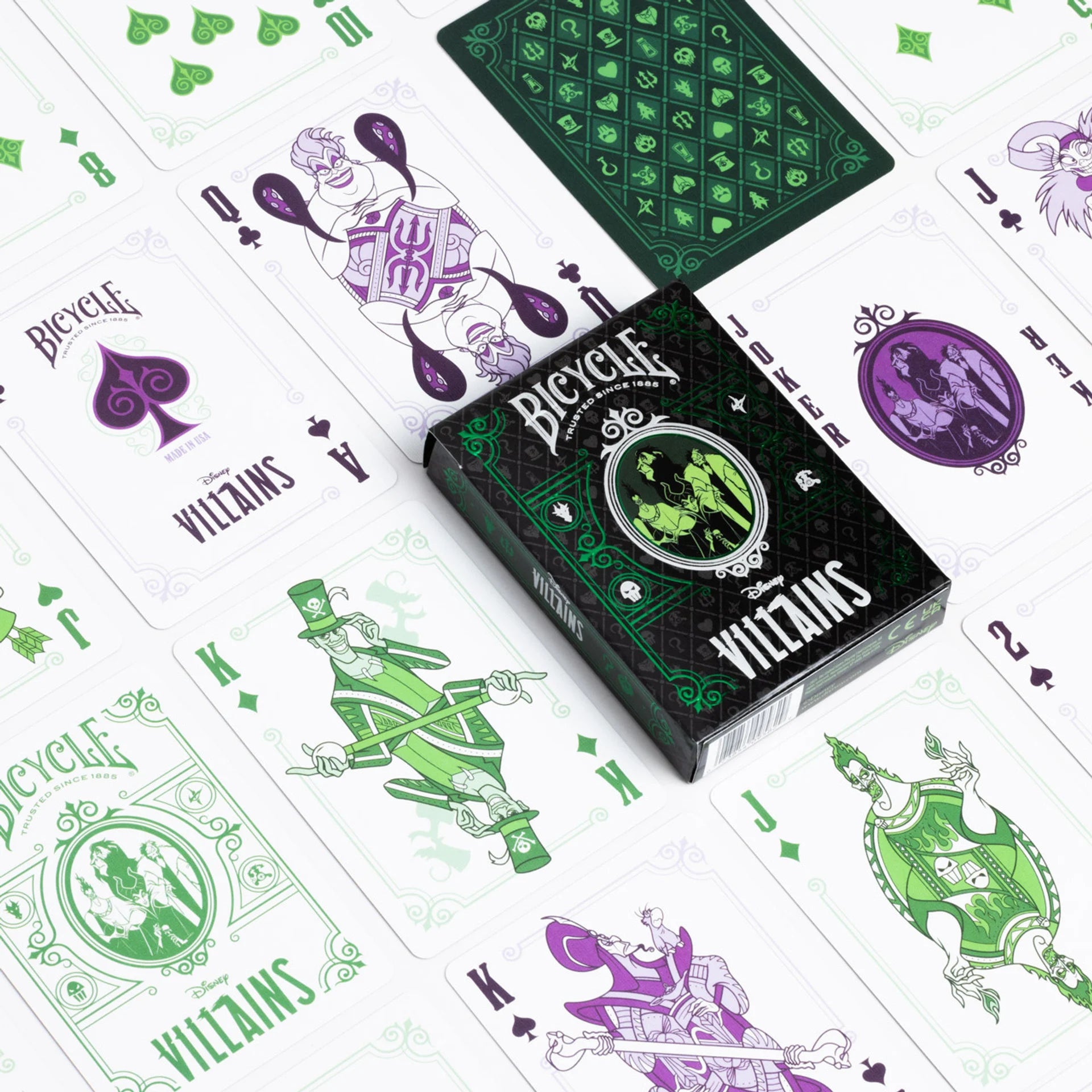 Bicycle Villains playing cards with green and purple designs on a white background