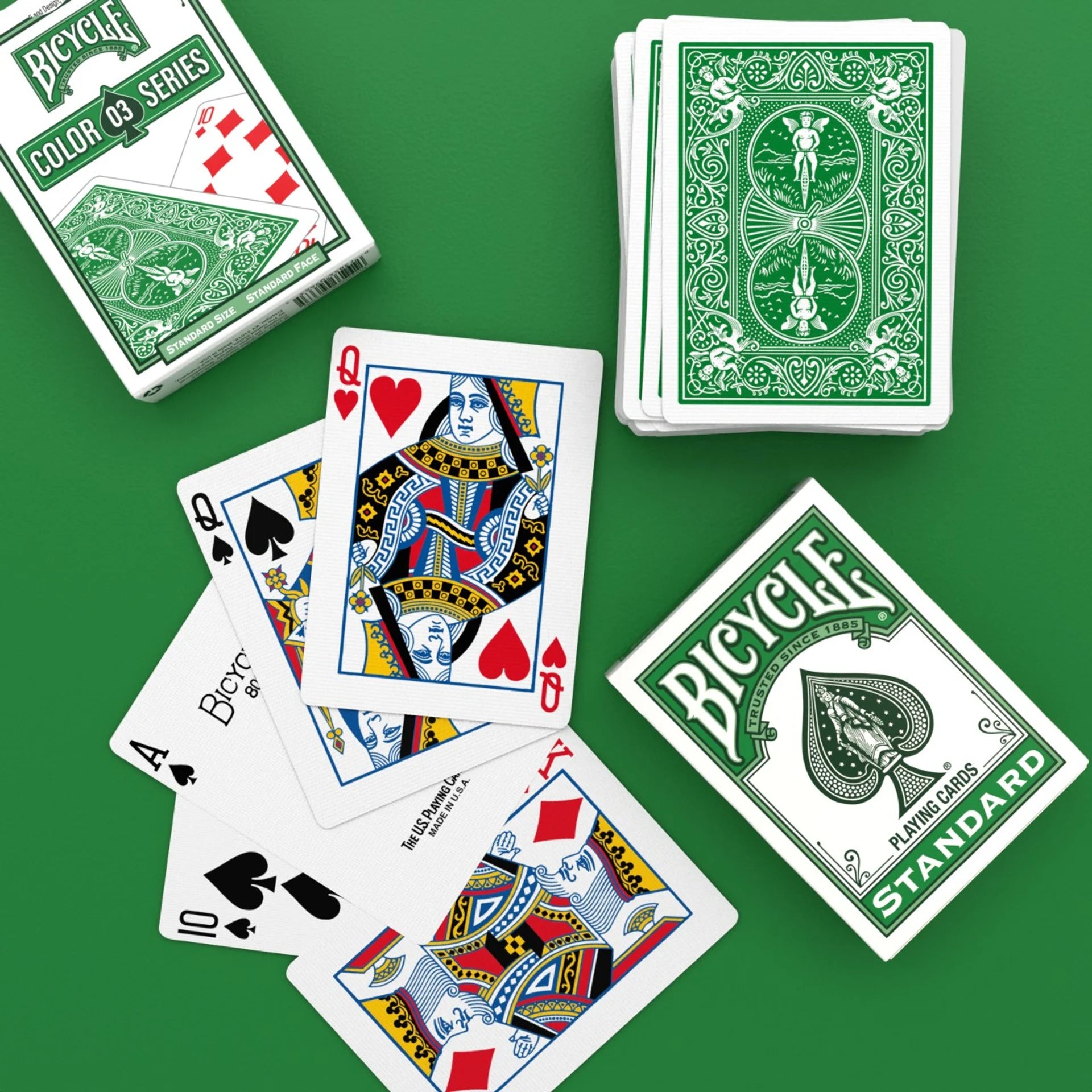 Bicycle playing cards on a green background