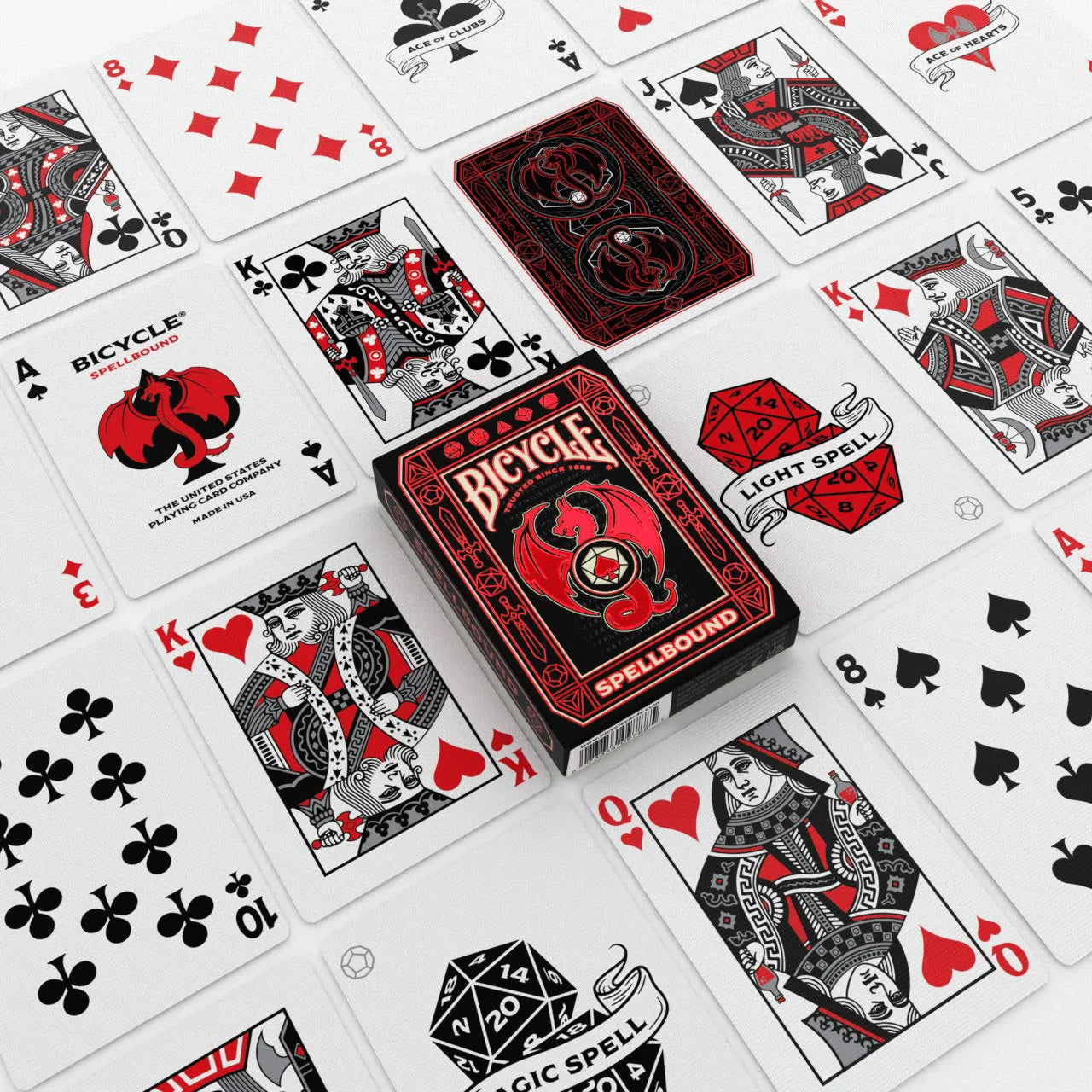 Bicycle Spellbound playing cards spread with custom courts, aces, spell cards, and tuck box