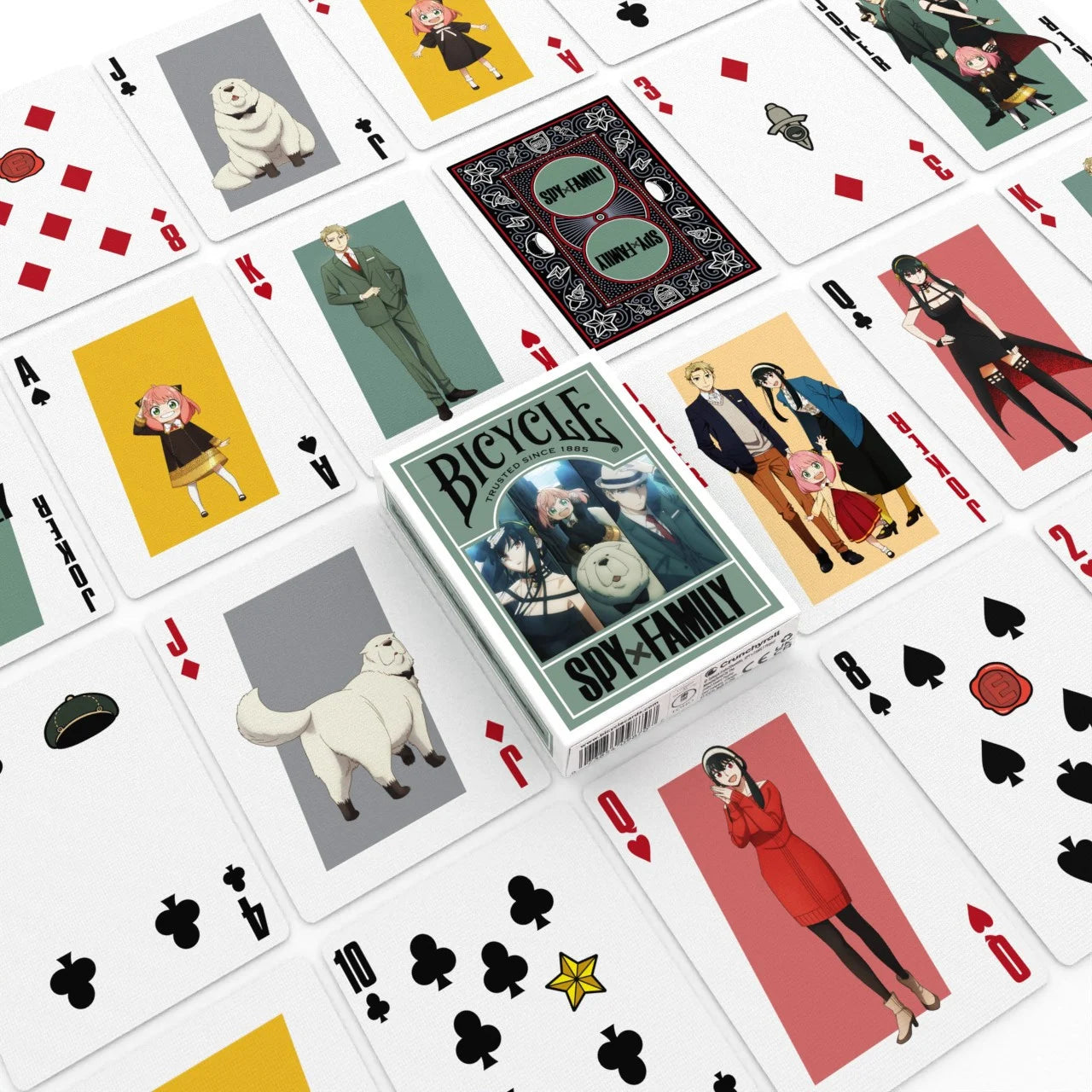 Bicycle Spy x Family deck spread out, showing anime character courts, custom backs, and tuck box in the center.