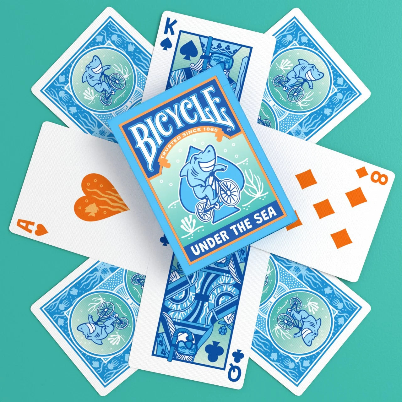 Bicycle Under the Sea playing cards spread with custom backs, courts, and tuck box