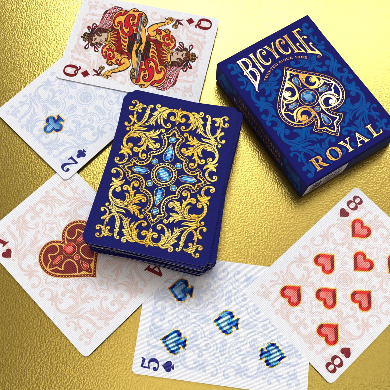 Bicycle Royal playing cards with ornate blue backs and gold design details
