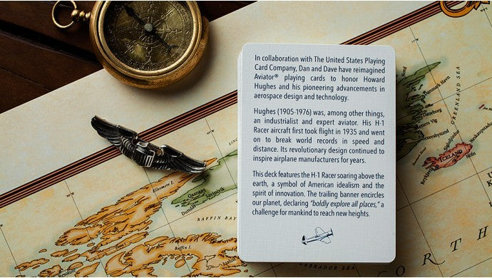 Card with text on a map background featuring a compass and necklace