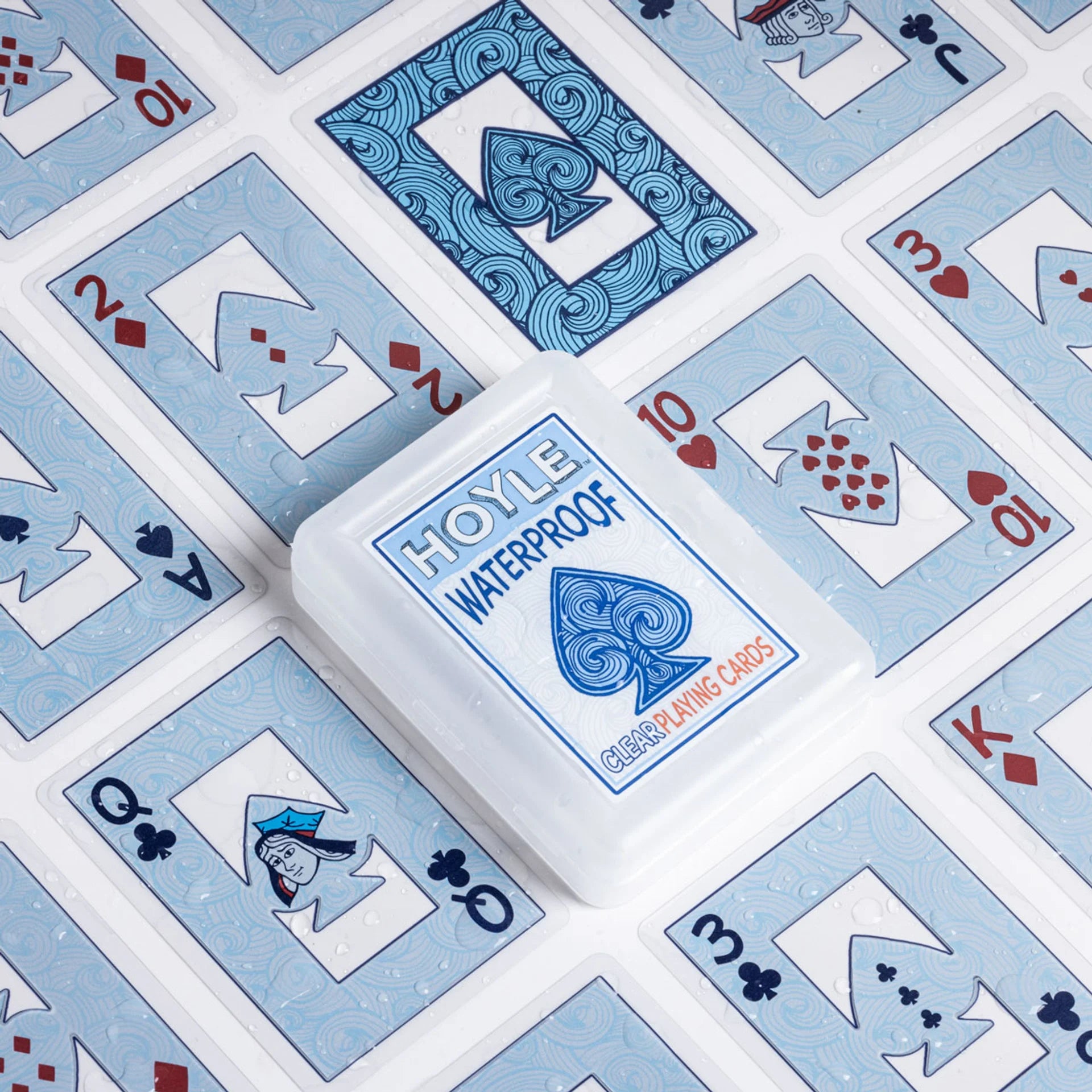 Spread of Hoyle Waterproof playing cards with card designs in the background