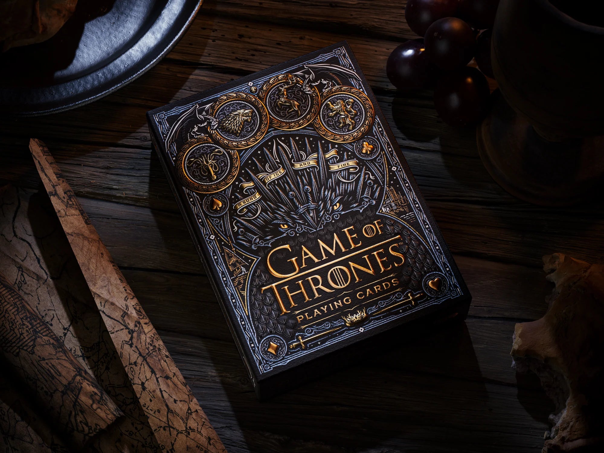 Theory11 Game of Thrones tuck box displayed on a wooden table with dramatic lighting