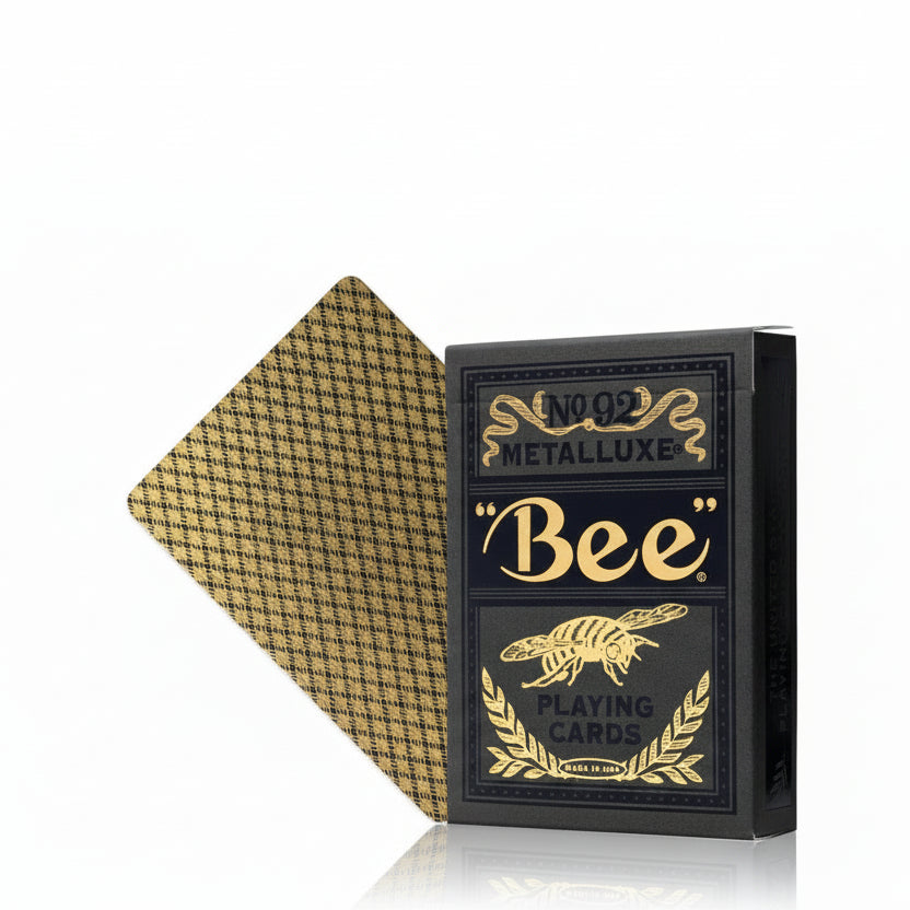 Playing card box with gold and black design featuring 'Bee' branding.