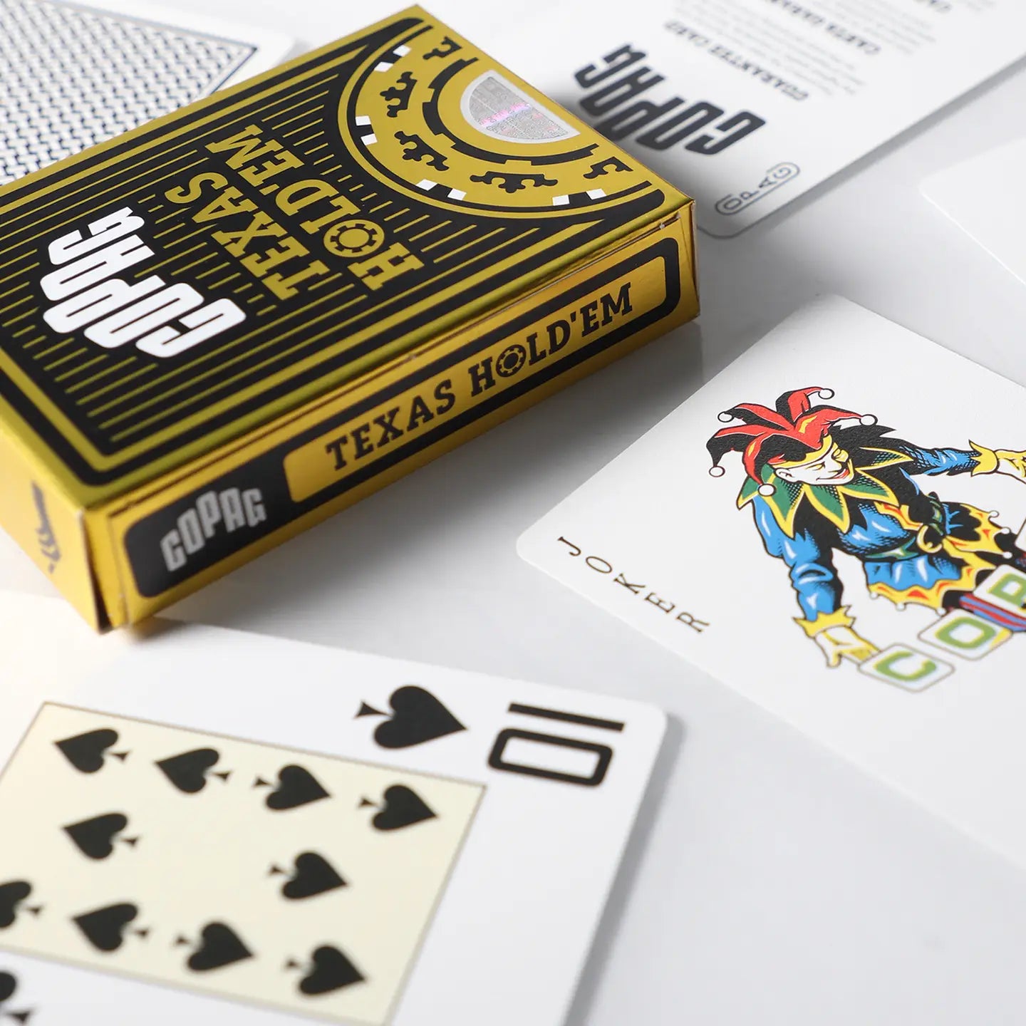 GOPAG Texas Hold'em playing cards with a joker card on a white surface