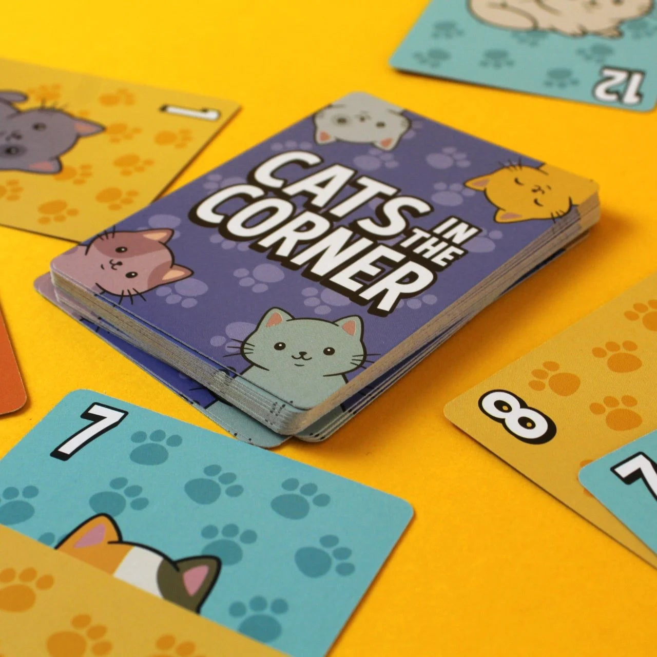 Bicycle Cats in the Corner card deck with purple cat-themed card backs