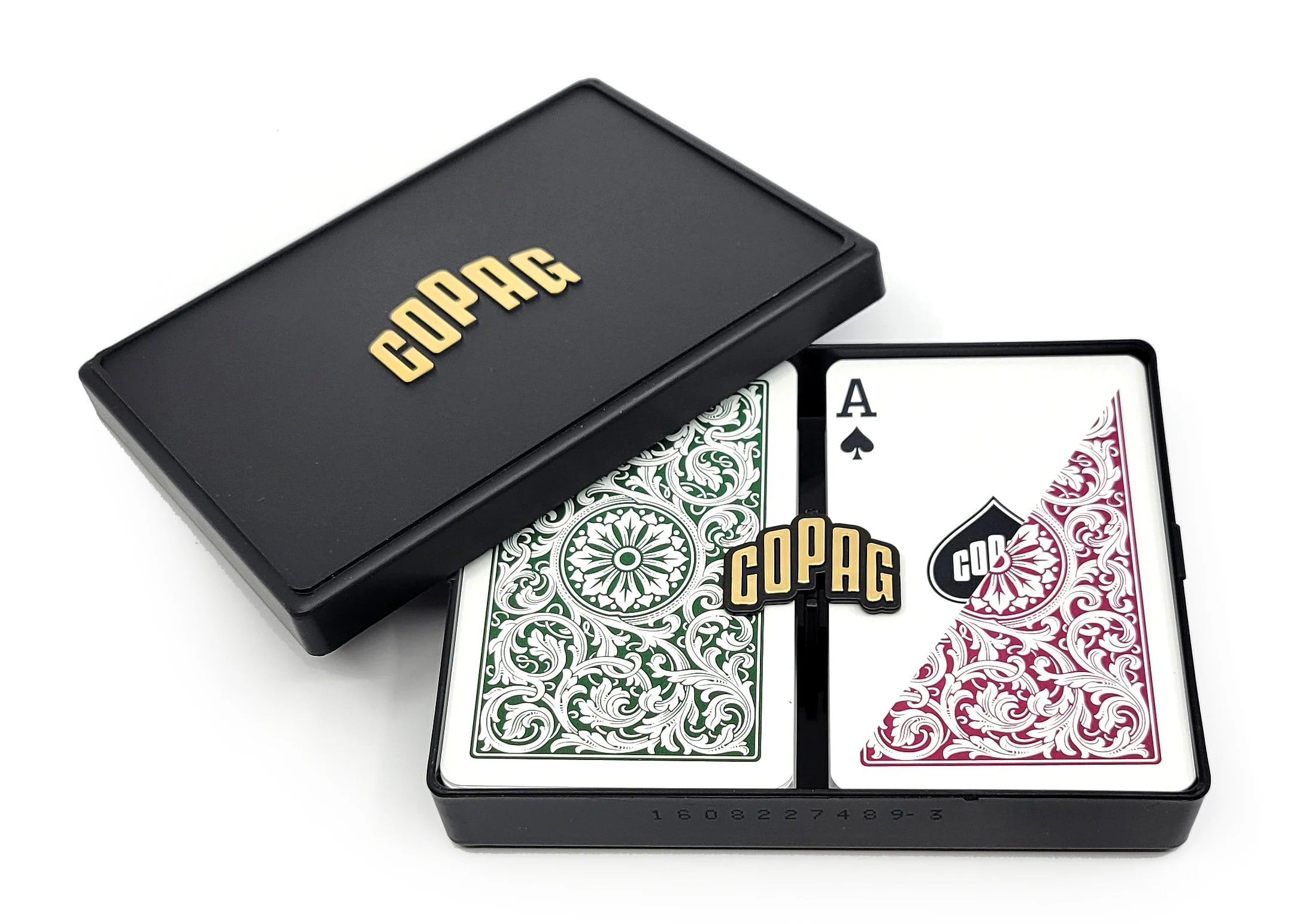 Open black Copag case showing two bridge-size decks with green and burgundy 1546 backs and an Ace of spades face card.