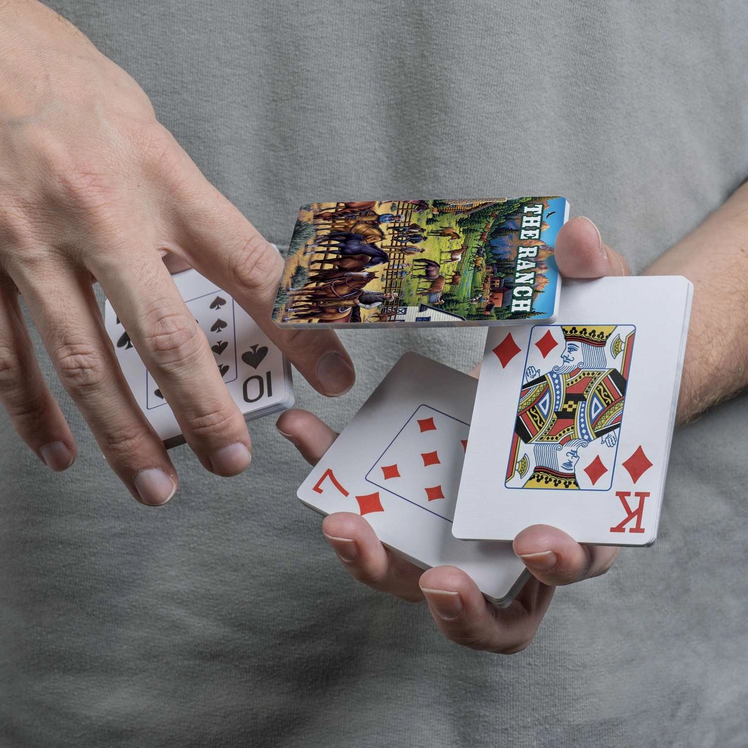The Ranch Playing Cards by Boardwalk card back with horses, ranch buildings, and mountain scenery
