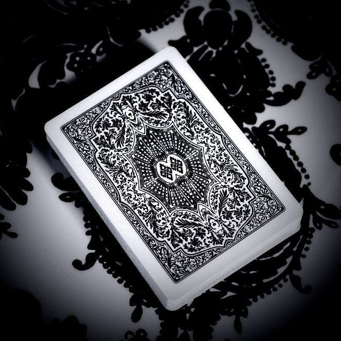 Arrco playing card with intricate design on a dark, patterned background