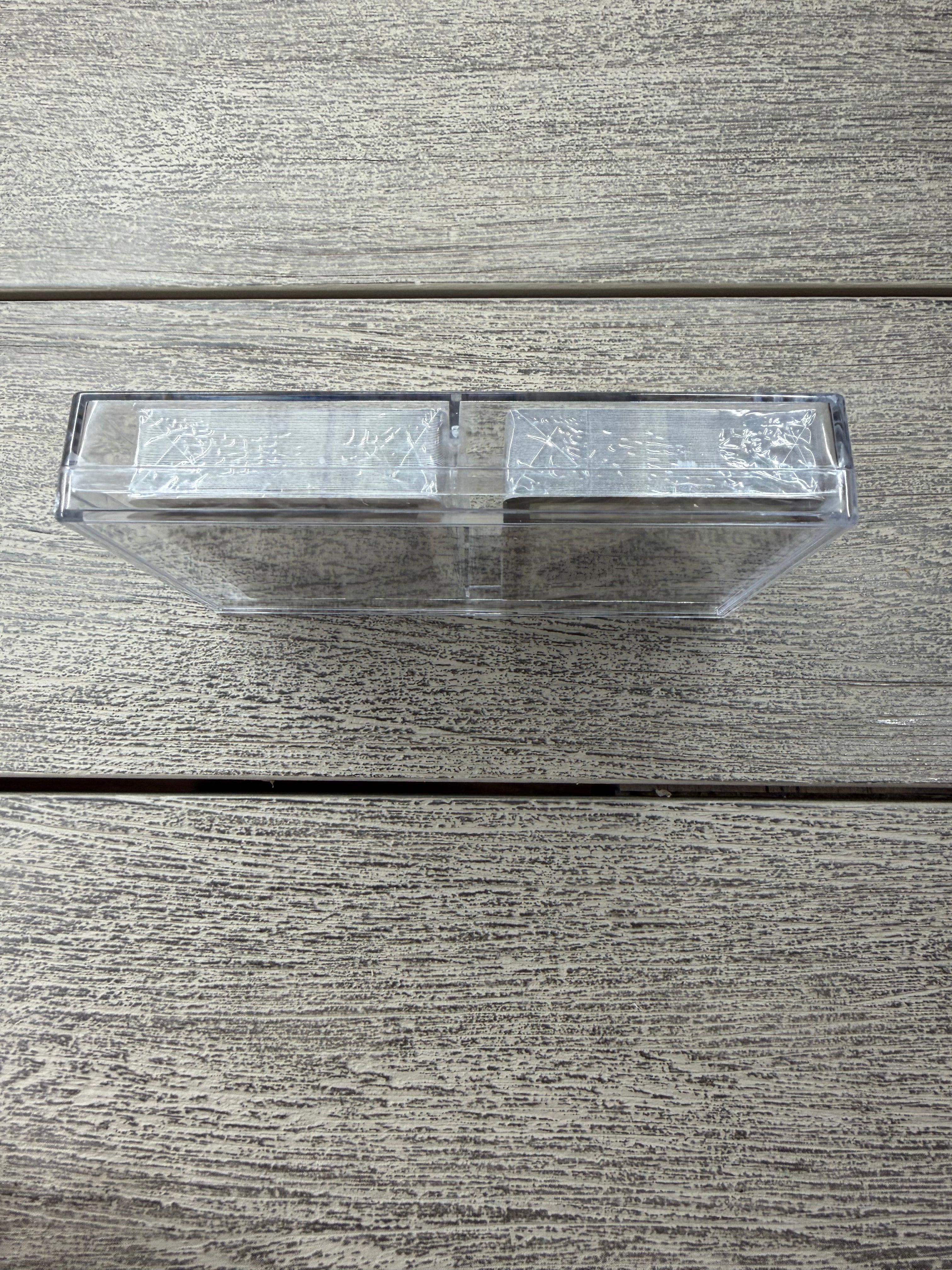 Close-up of a textured wooden door with a metallic handle.