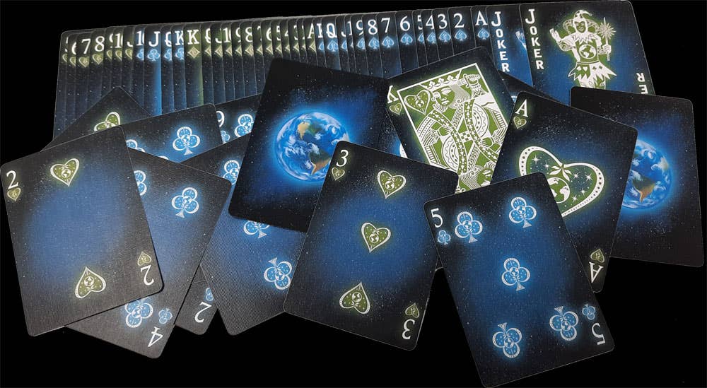 Playing cards with glowing blue edges on a black background