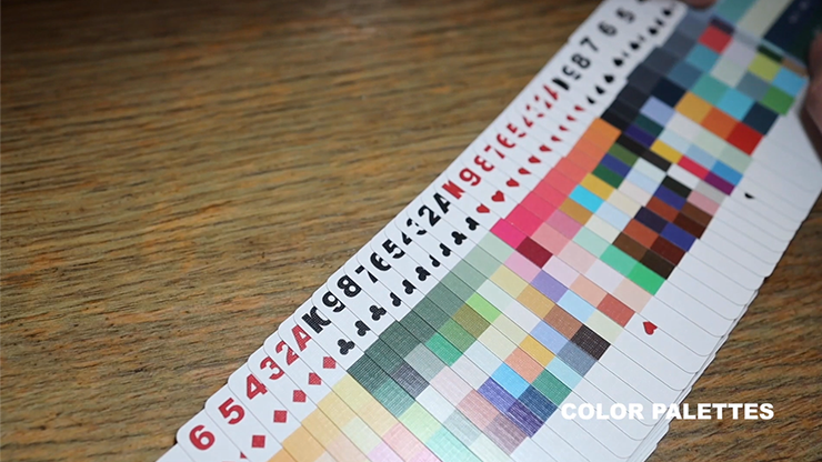 Color swatch chart with numbers and symbols on a wooden surface