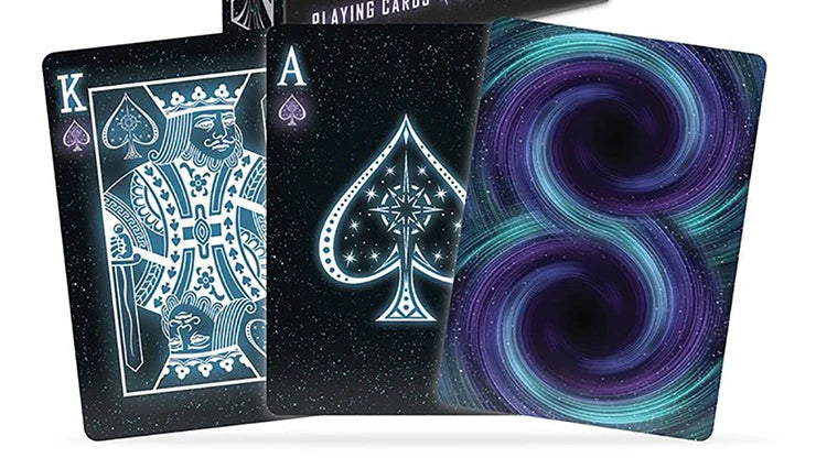 Three playing cards with different designs on a white background