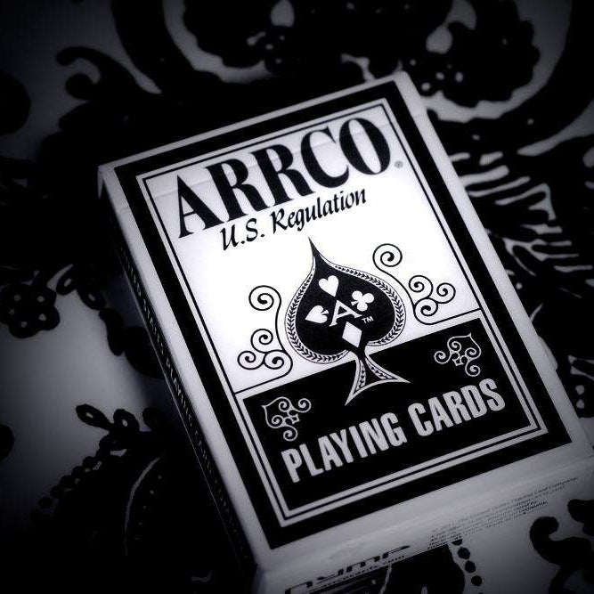 ARRCO playing cards with black and white design on a dark background