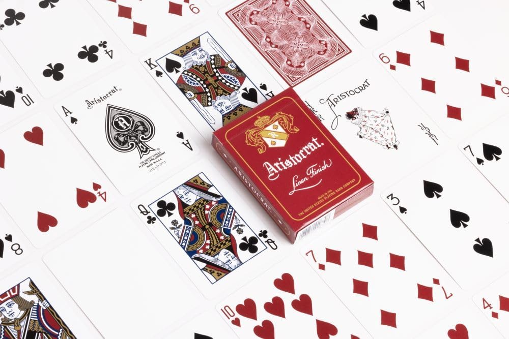 Red Aristocrat playing cards with tuck box and face cards on white background