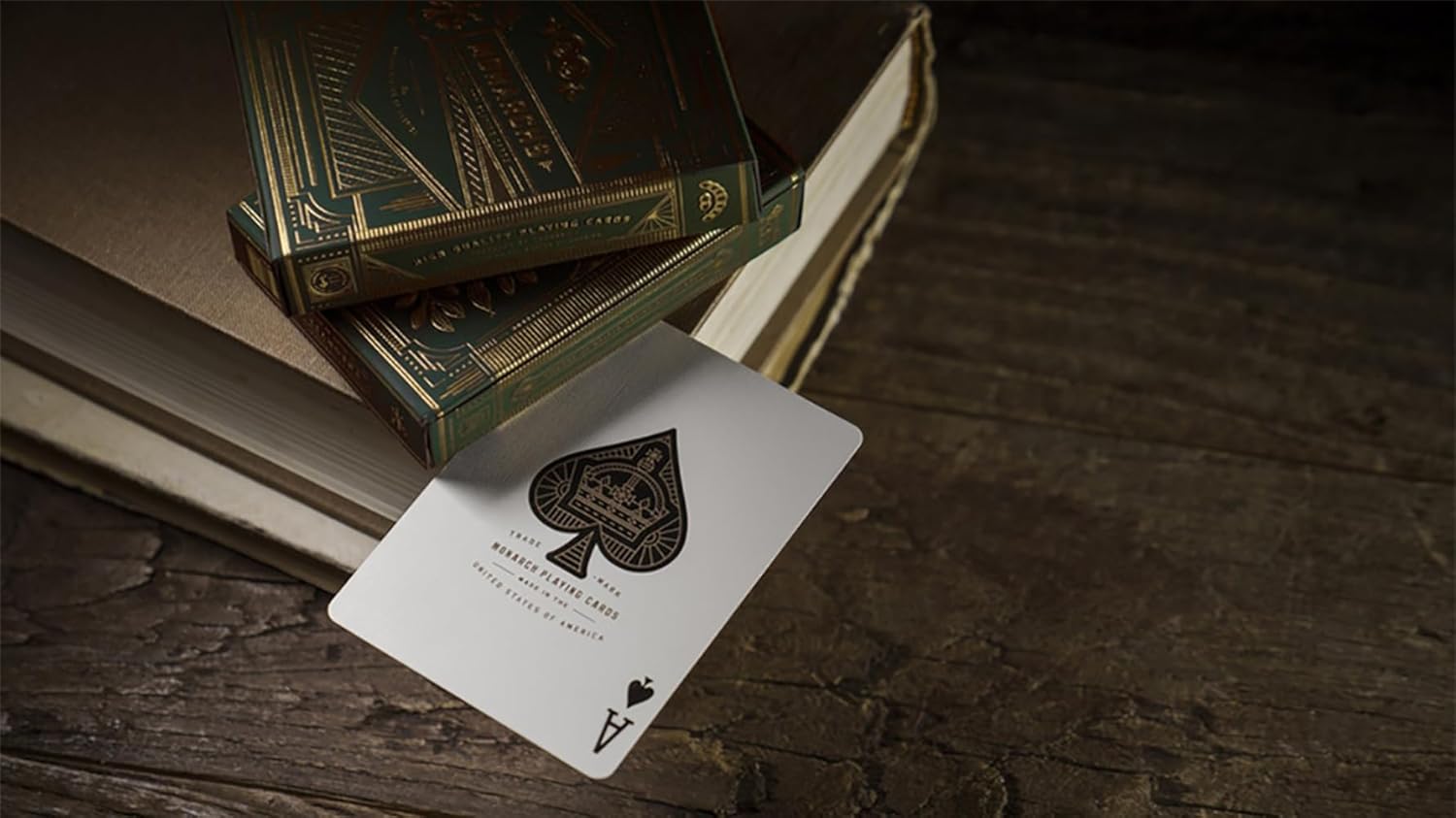Playing card with a spade symbol on a wooden surface