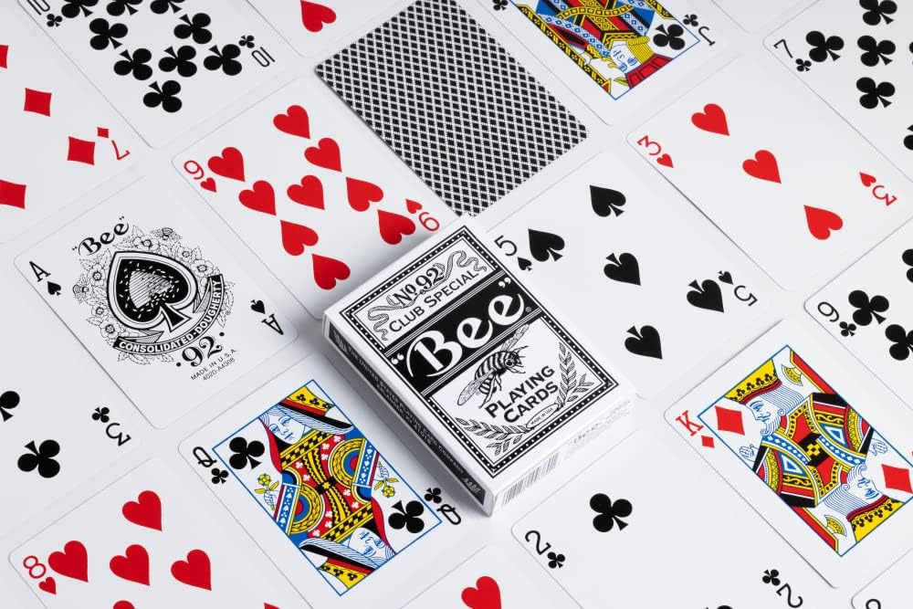 Playing cards with a visible 'Bee' brand packaging