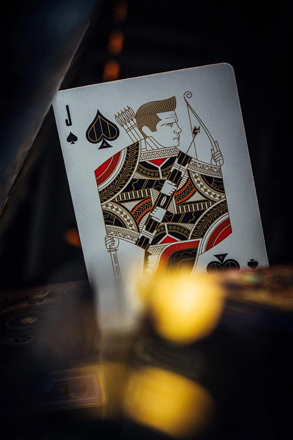 Jack of Spades playing card with intricate design on a dark background