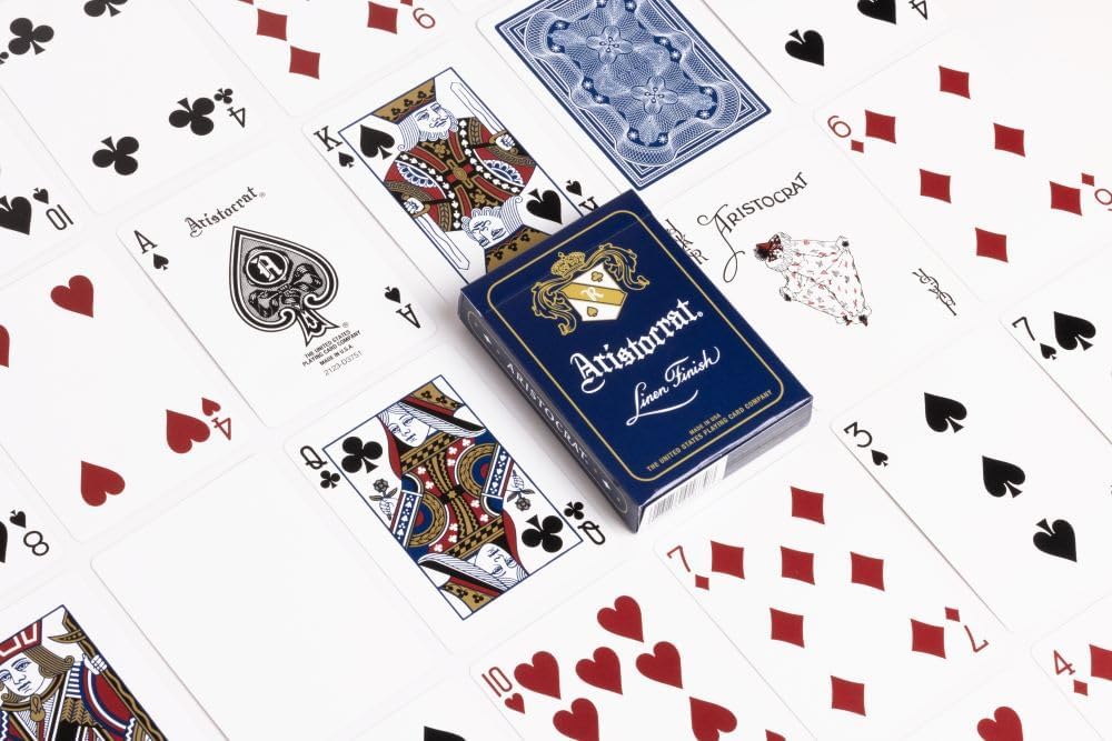 Blue Aristocrat playing cards with tuck box and face cards on white background