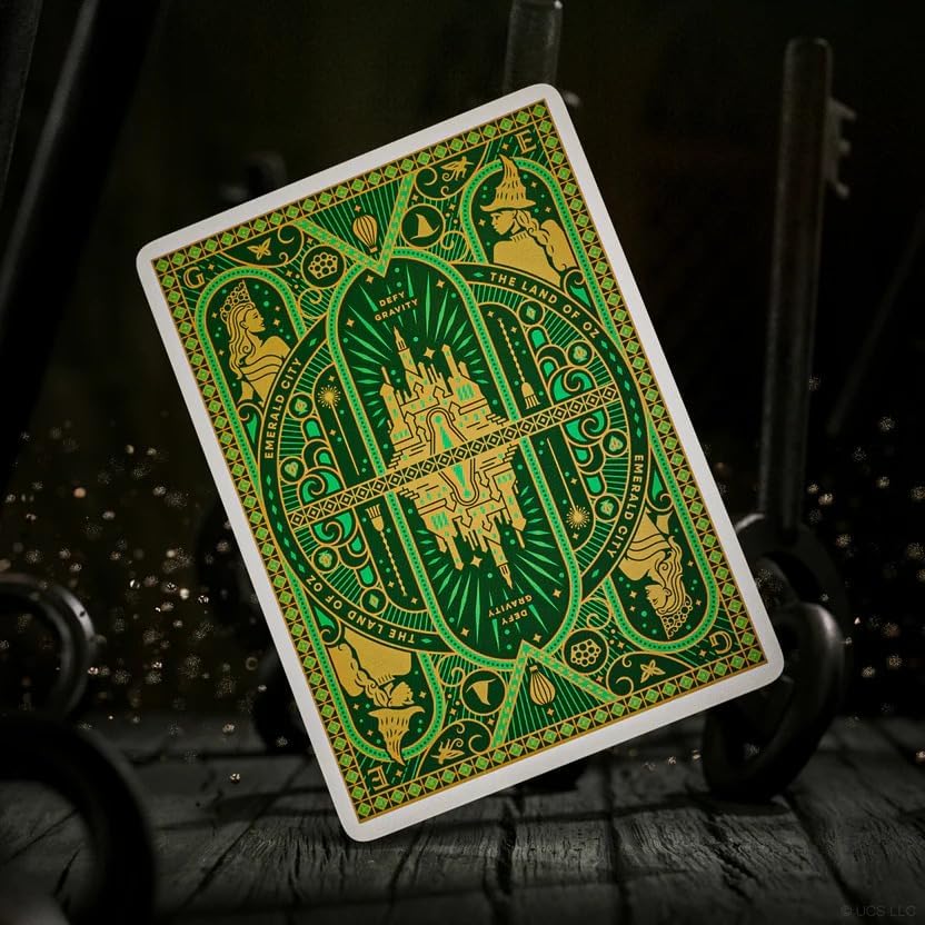 Green and gold playing card with intricate Emerald City design on a dark background