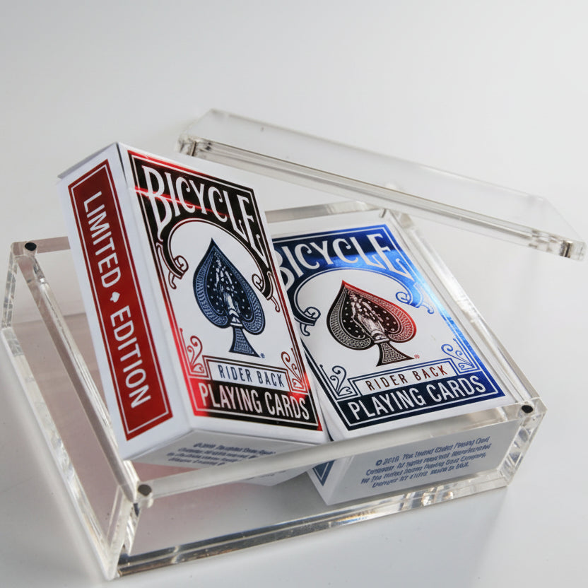 Open Carat case with lid raised, revealing red and blue Bicycle Rider Back mini foil tuck boxes inside.