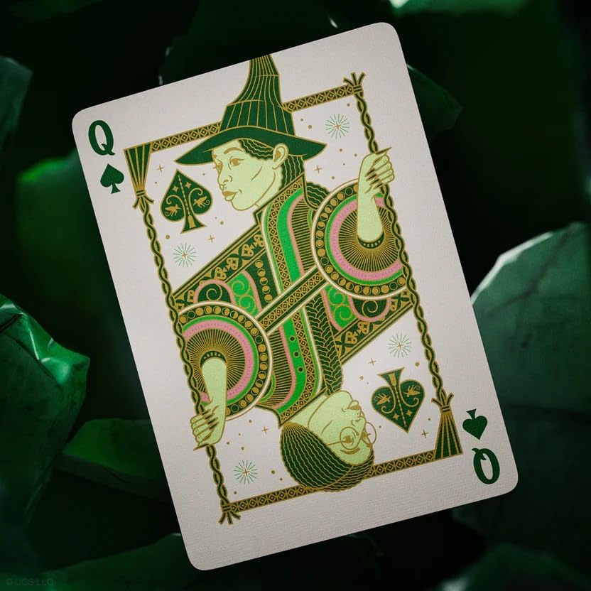 Playing card featuring a queen of spades with decorative design on a dark background
