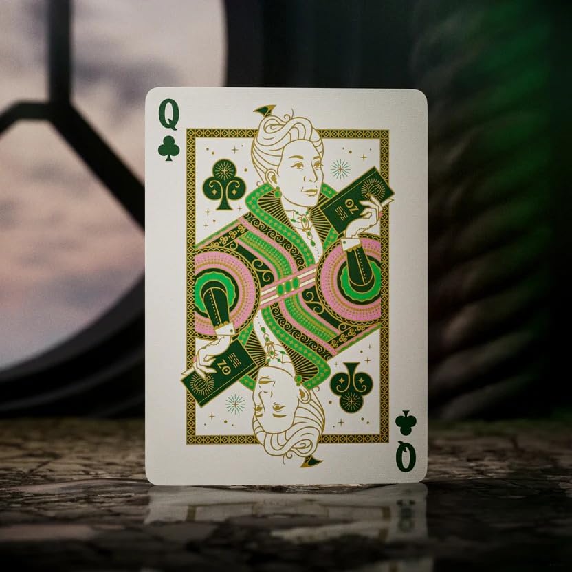 Queen of Clubs playing card with decorative design on a wooden surface