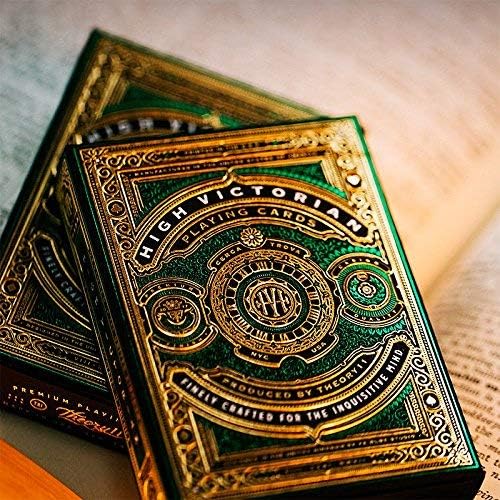 High Victorian Playing Cards with ornate gold and green design on a textured surface