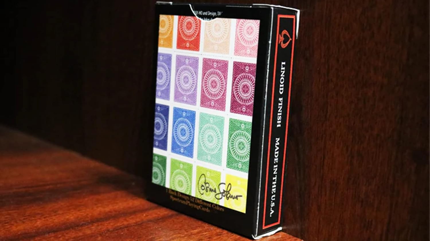 Back of Tally Ho Spectrum playing cards on a wooden surface