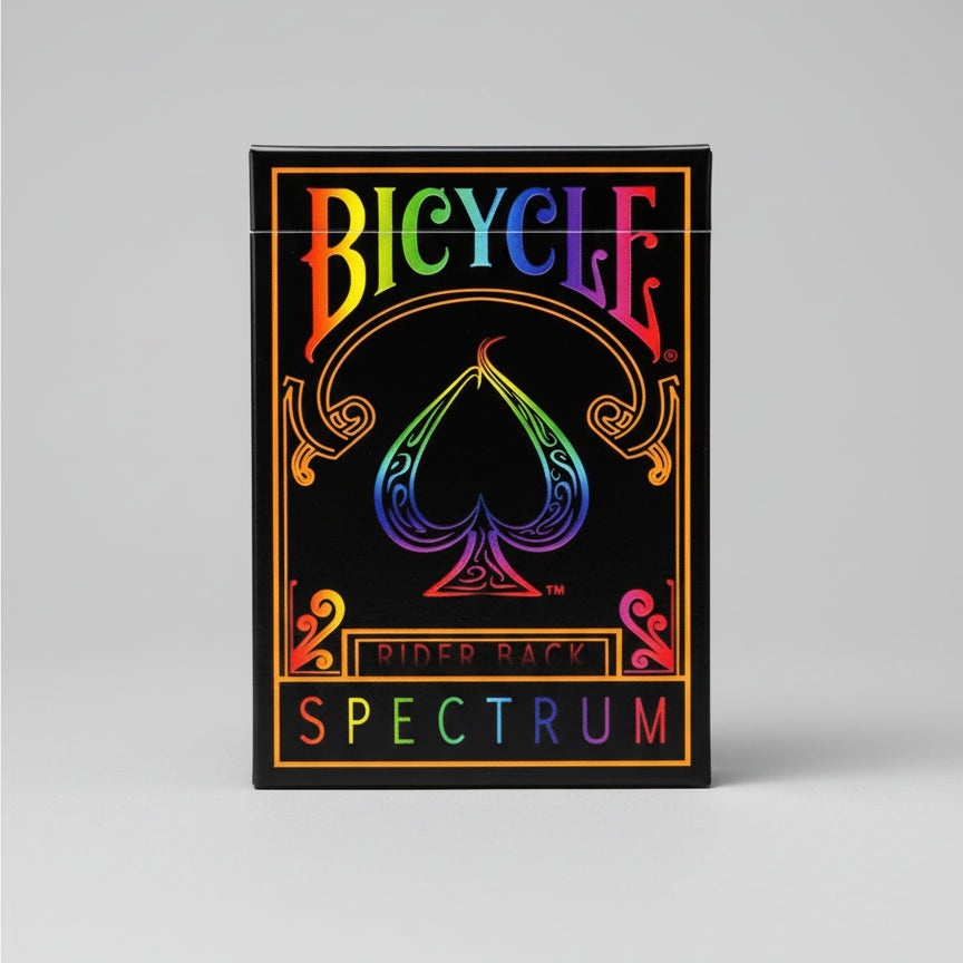 Bicycle Spectrum playing cards with rainbow spade logo on a black background