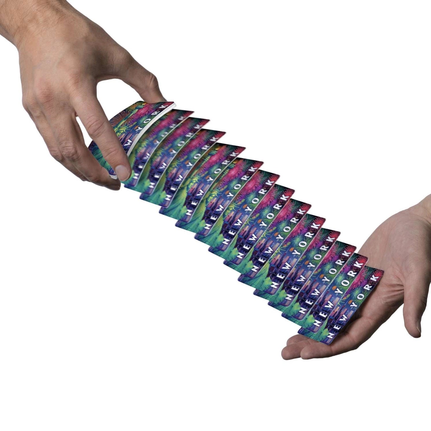 Boardwalk New York playing cards cascading between two hands with colorful Lady Liberty backs visible