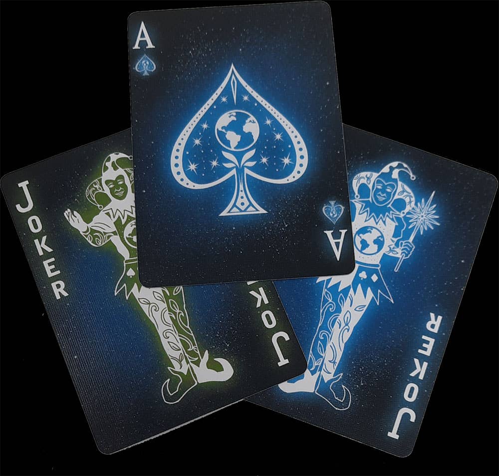 Playing cards with blue and green design on a black background