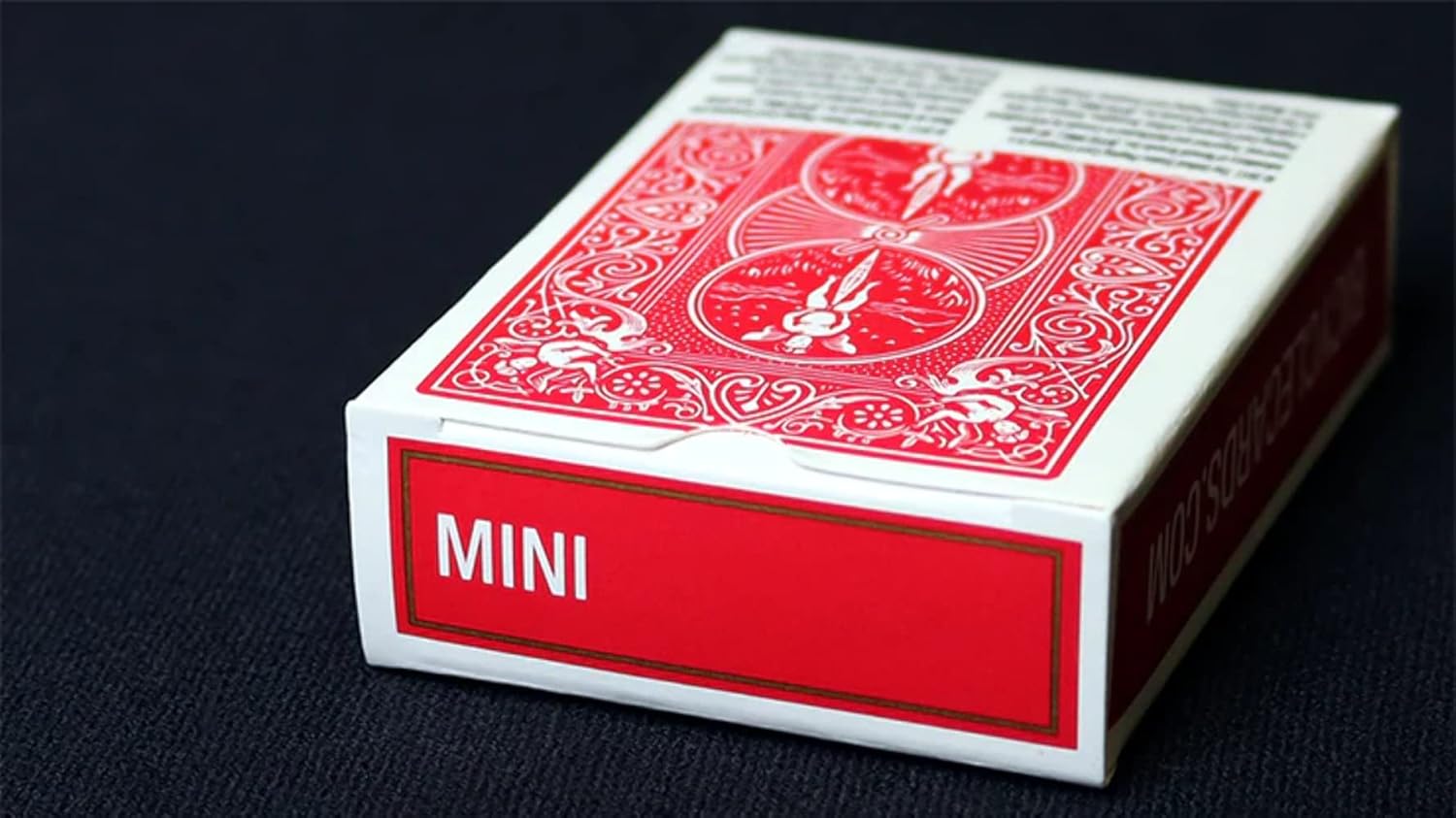 Red and white Bicycle mini playing card box on a black background