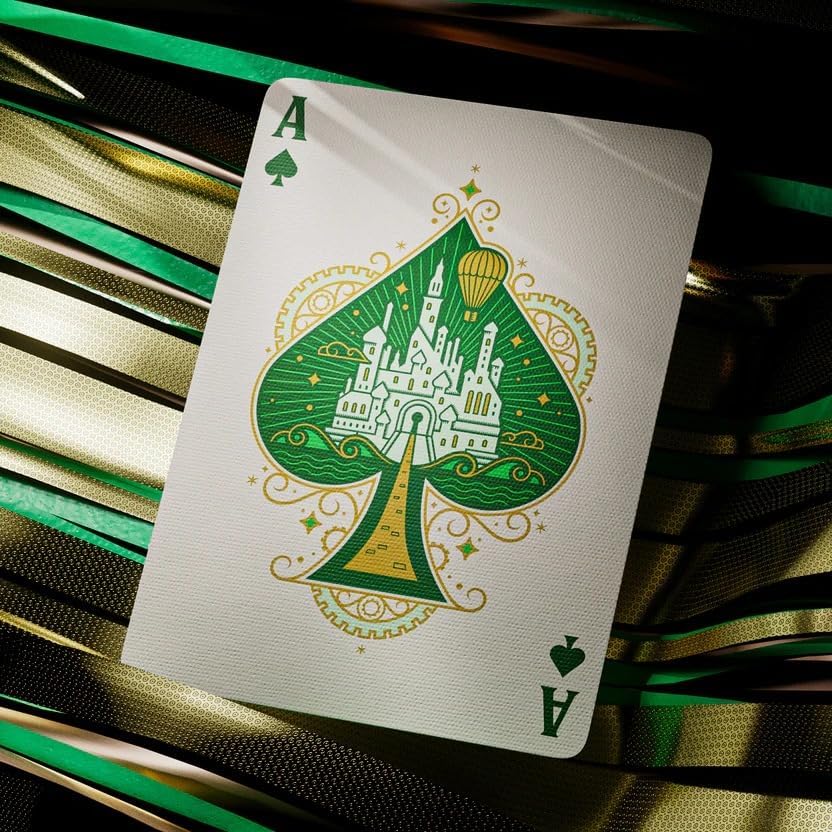 Playing card with green spade suit symbol featuring a castle design on a striped background