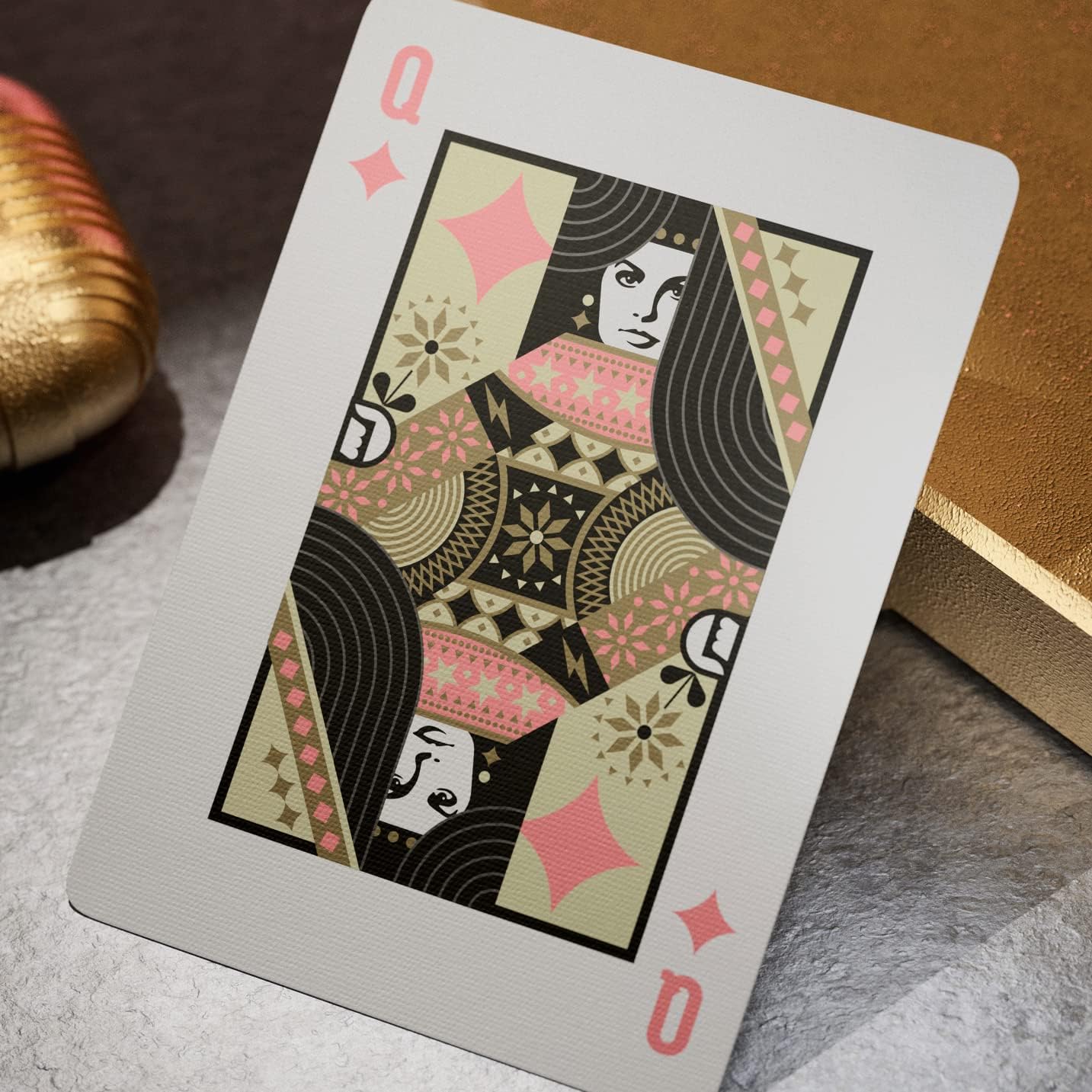 Queen of diamonds from Theory11 Elvis deck with ornate pink and gold costume artwork.