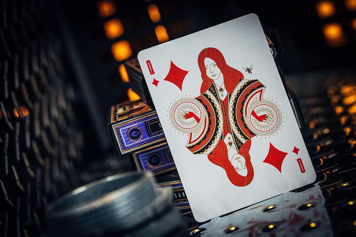 Playing card with a red and black design on a dark background