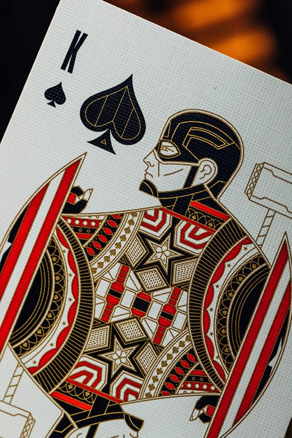 Playing card featuring a detailed illustration of a character with spade symbol