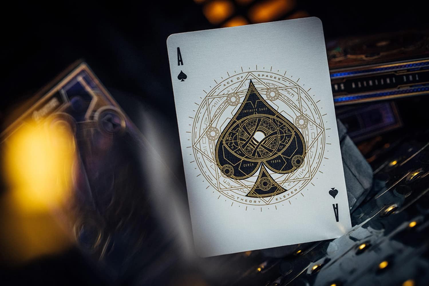 Playing card with detailed spade design on a dark background