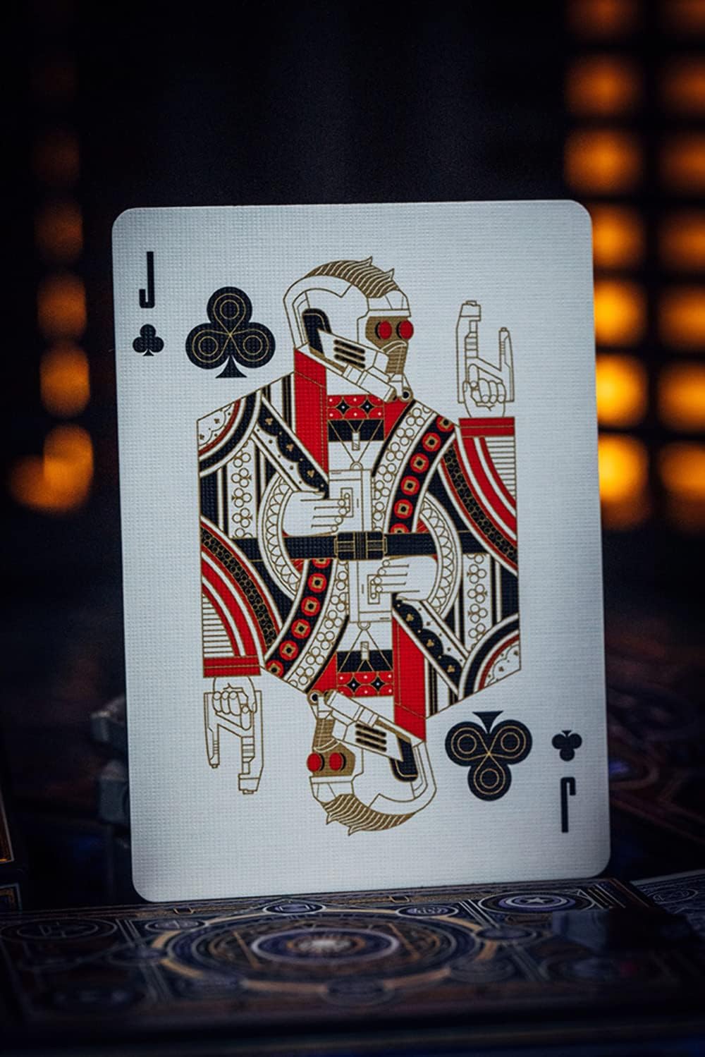 Playing card with a robot design on a dark background