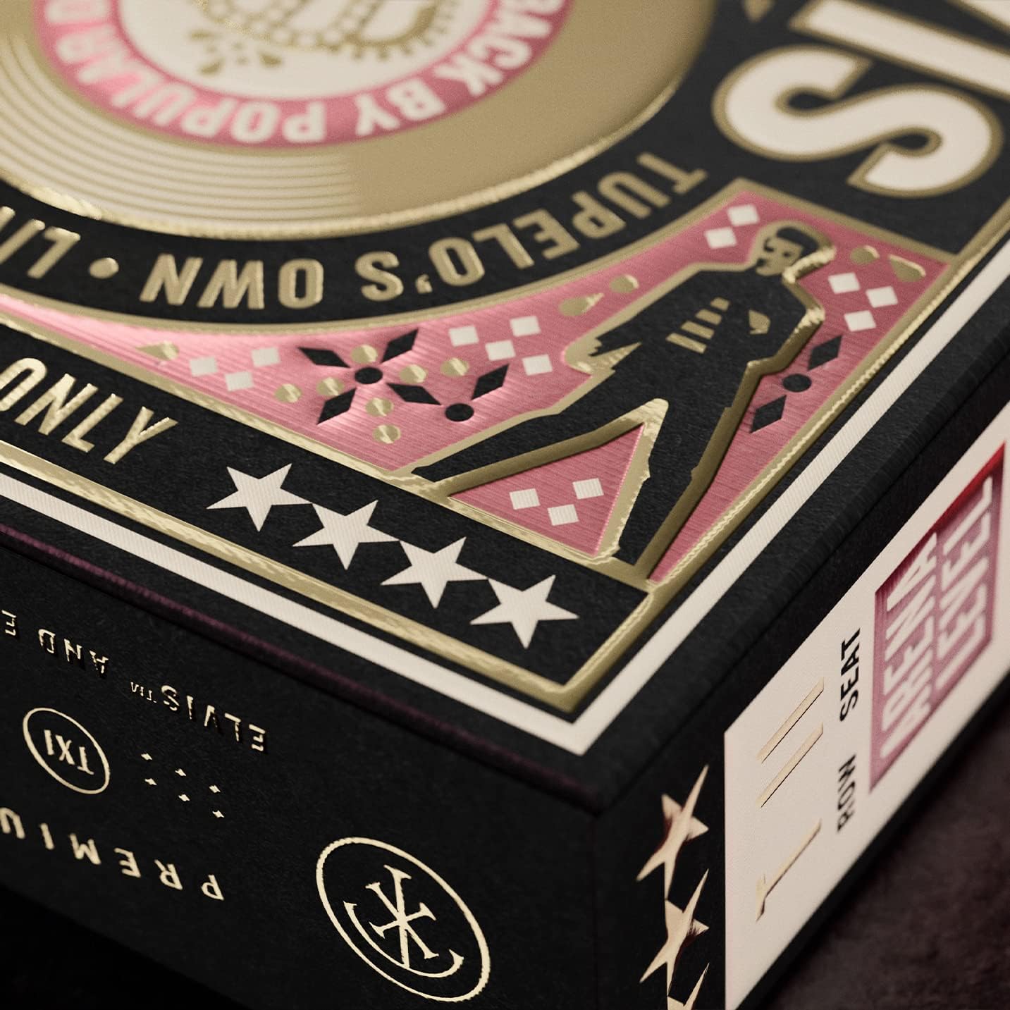 Corner detail of Elvis tuck with embossed gold silhouette of Elvis and four‑star border.