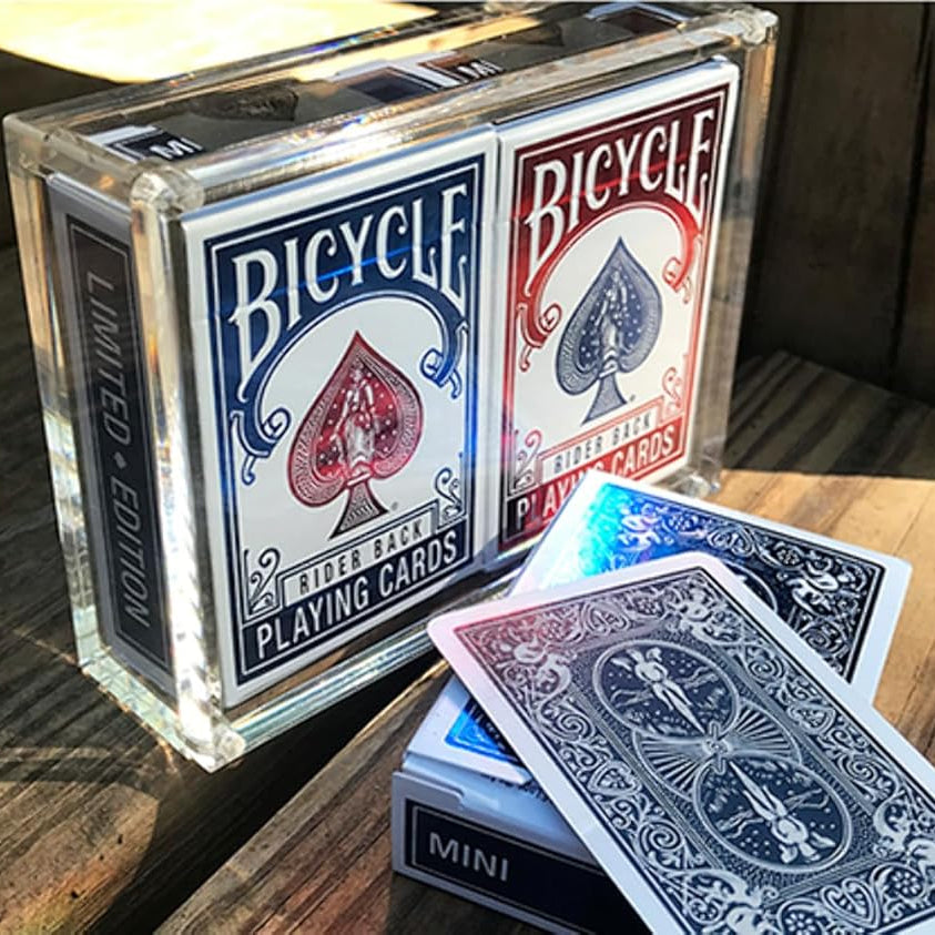 Carat case showing both red and blue Bicycle Rider Back mini decks next to an open blue mini deck with cards fanned.
