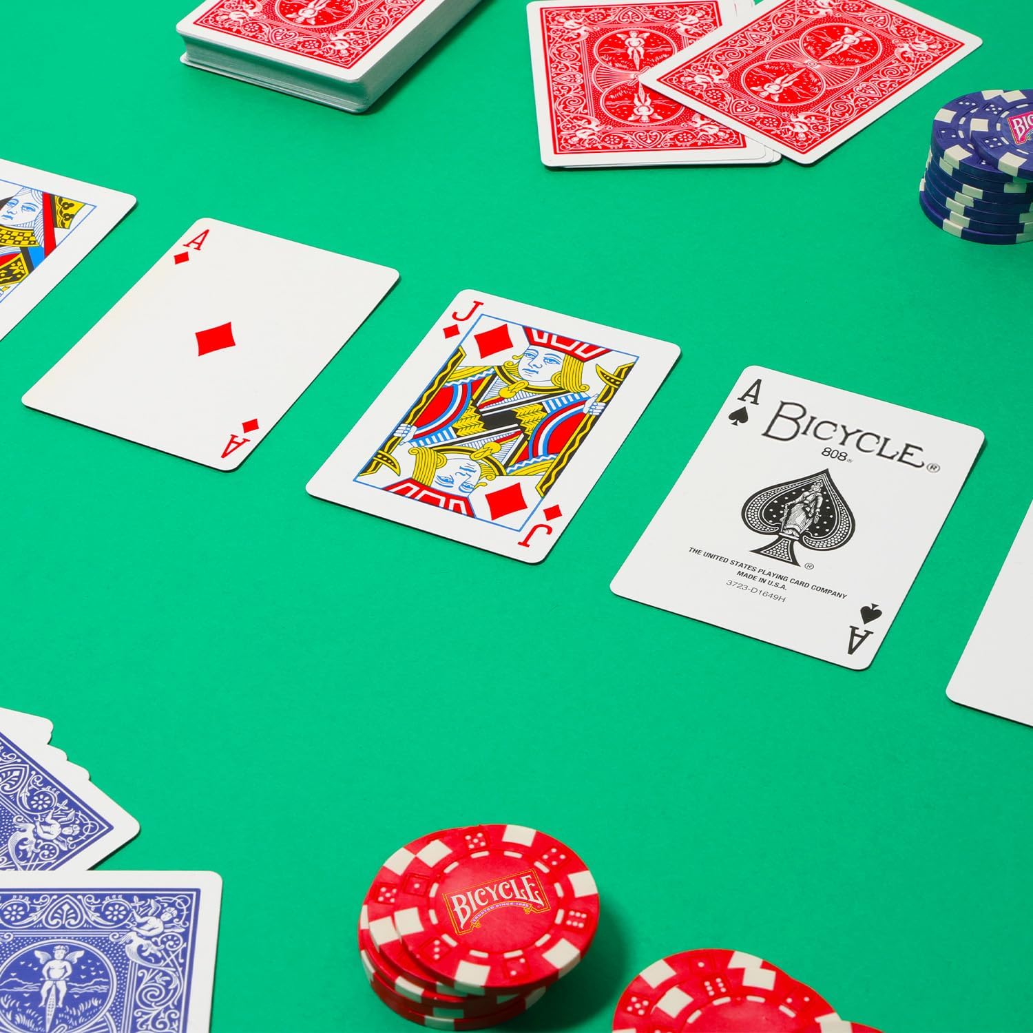 Playing cards and poker chips on a green table