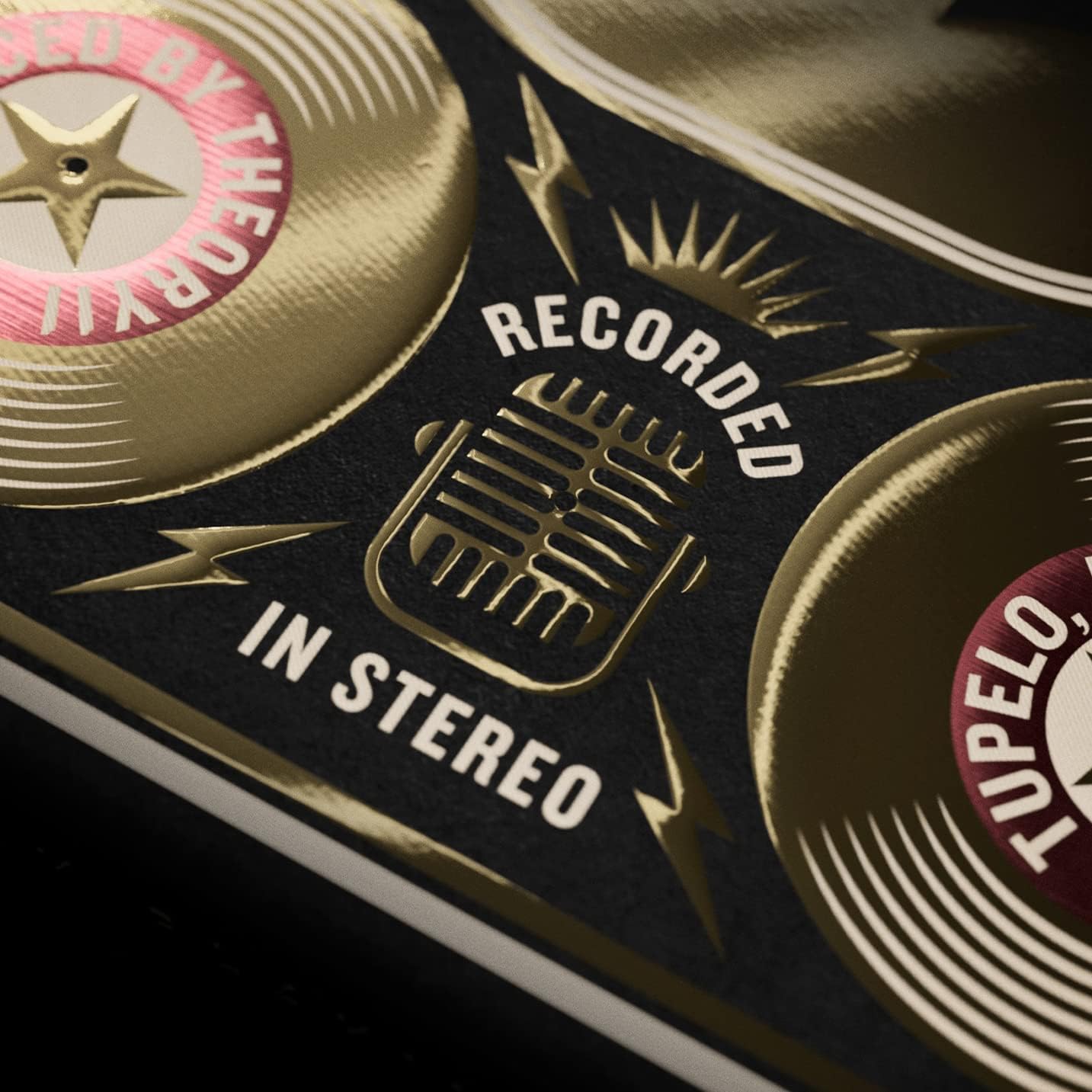 Detail of microphone and ‘Recorded in Stereo’ text on Elvis tuck in gold foil.