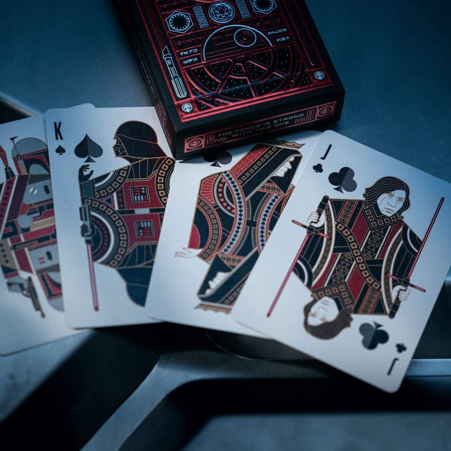 Playing cards with unique designs on a dark surface