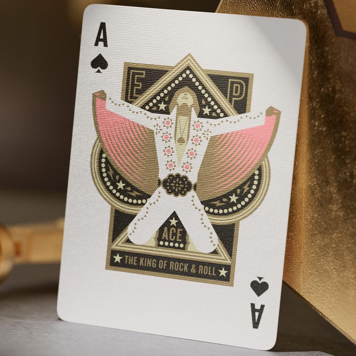 Ace of spades from Theory11 Elvis deck showing Elvis jumpsuit silhouette labeled ‘The King of Rock & Roll.’